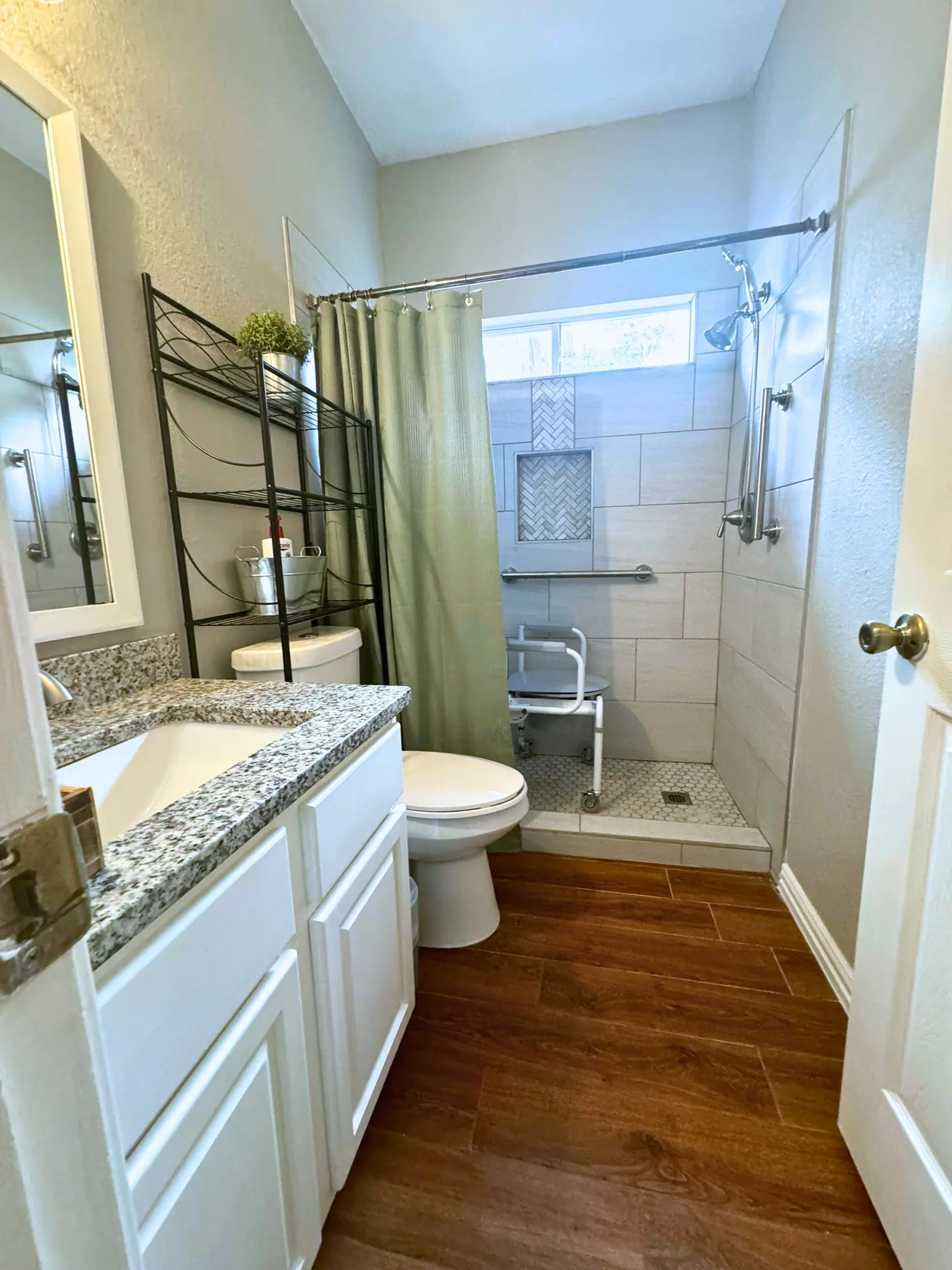 Accessible bathroom with walk-in shower and grab bars